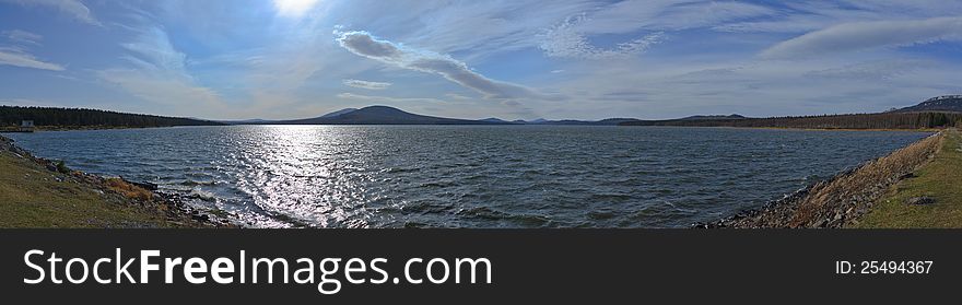 Panorama Reservoir on the background of the mountains. Russia, the National Park Zyuratkul