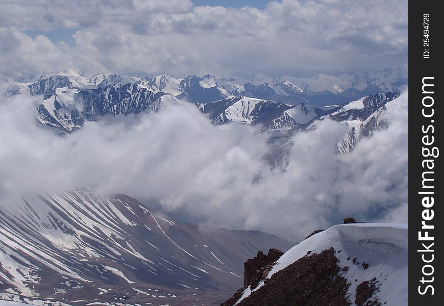 Mountain Valley shot from above the clouds Tien Shan