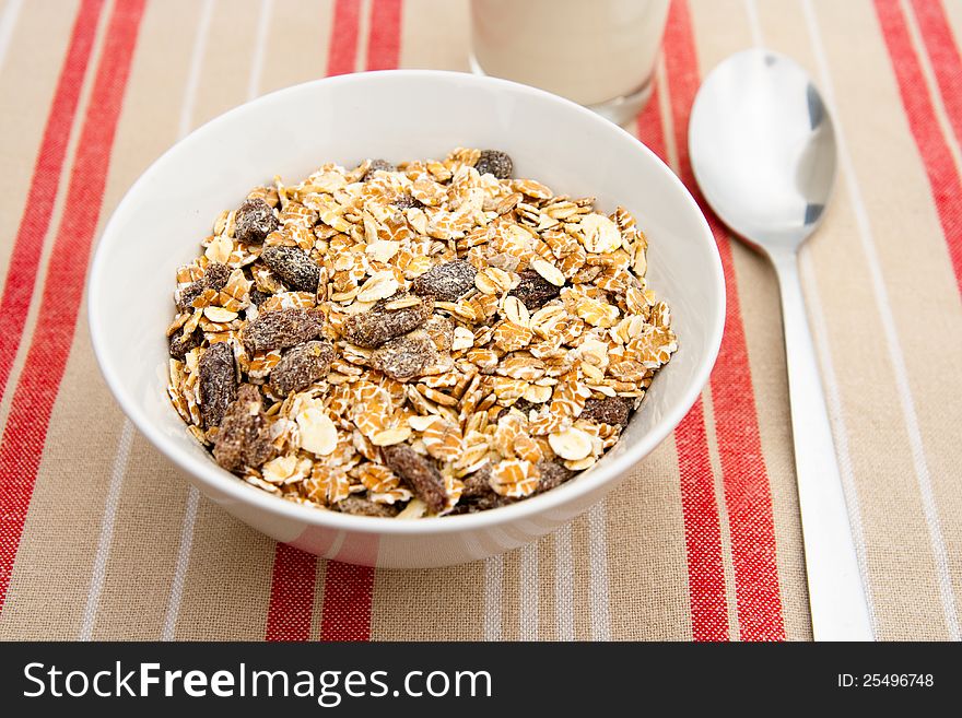 Healthy muesli breakfast with a glass of milk. Healthy muesli breakfast with a glass of milk