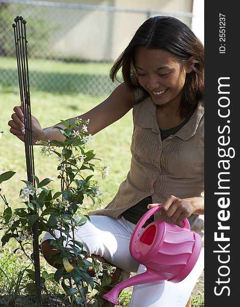 Young lady in garden with flowers. Young lady in garden with flowers