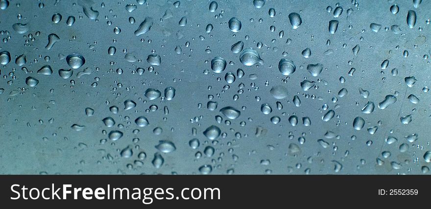 Water drops on glossy surface