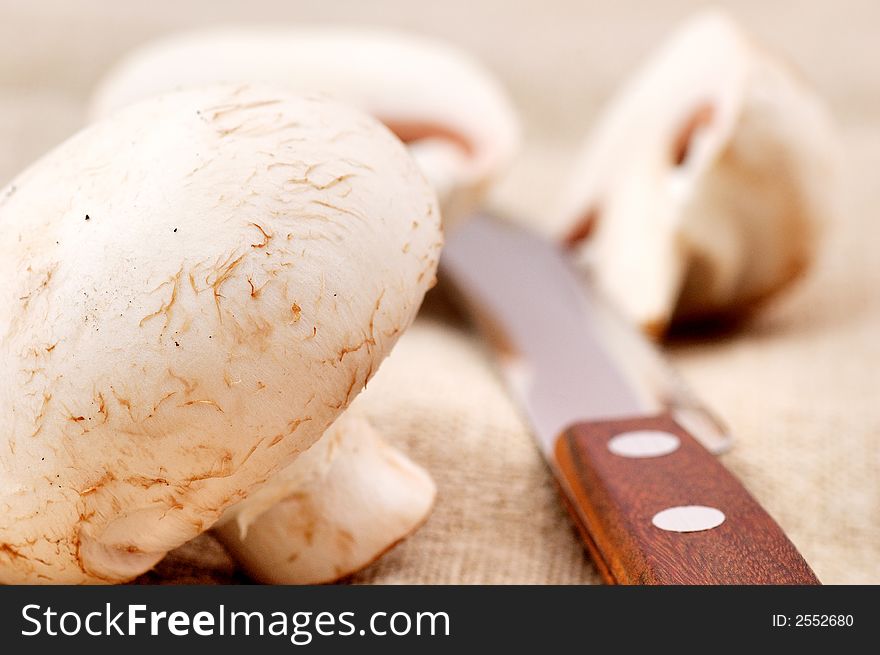 Mushrooms and knife on the table