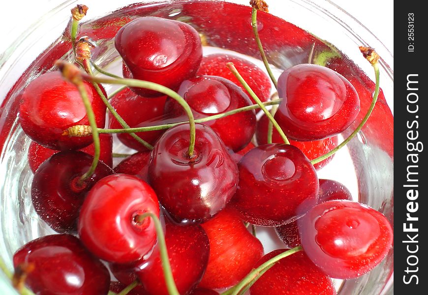 Fresh cherries in a glass bowl filled with water. Fresh cherries in a glass bowl filled with water