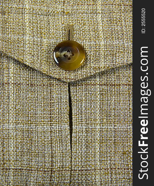 Closeup of jacket's pocket with button. Closeup of jacket's pocket with button