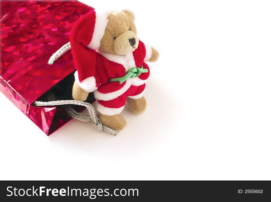 Small santa teddy with a red gift bag. Small santa teddy with a red gift bag