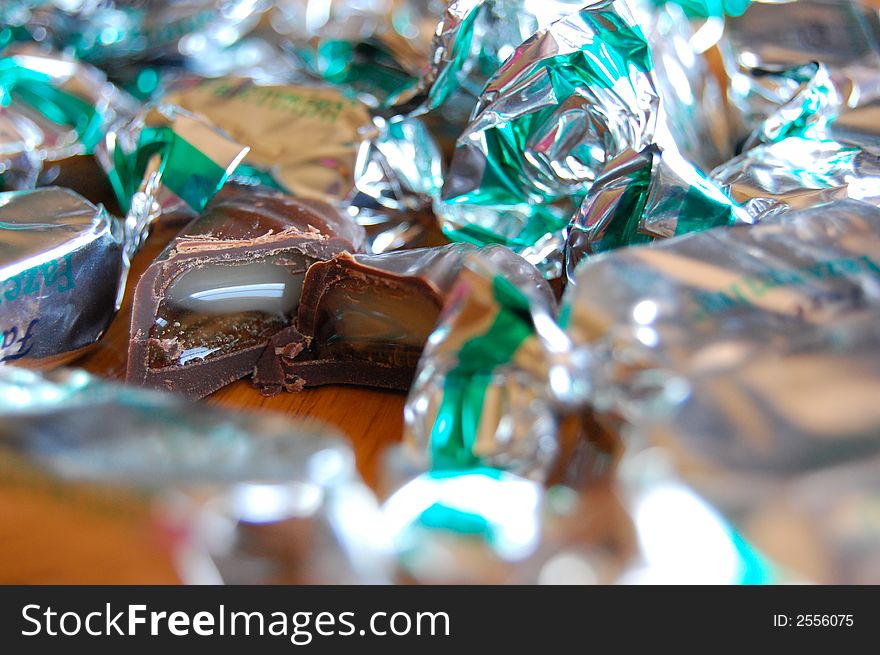 Mint chocolate candy with gooey center and bright silver wrappers. Mint chocolate candy with gooey center and bright silver wrappers.