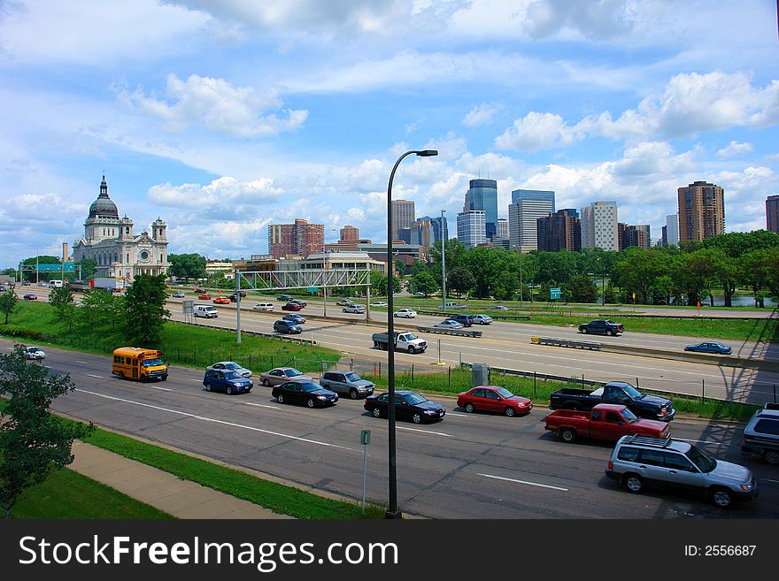 A picture of the Minneapolis skyline overlooking expressway. A picture of the Minneapolis skyline overlooking expressway