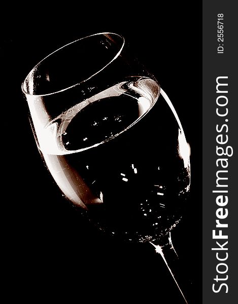 Tall wine glass over black background. Tall wine glass over black background