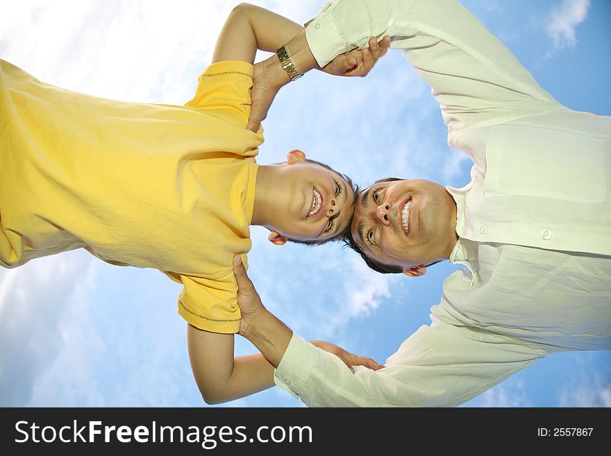 Father with child on a background of the sky