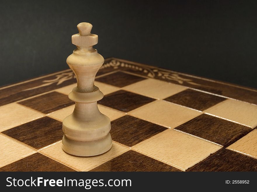 Isolated white king on the chess battlefield. Isolated white king on the chess battlefield