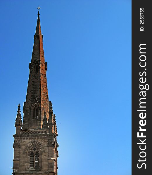 Church Spire in Chester England UK against blue sky in spring