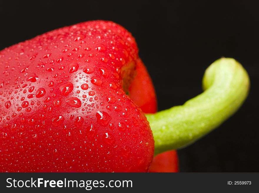 Red bell pepper isolated on black