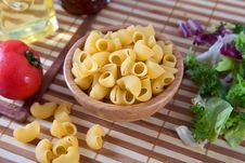 Uncooking Pasta In Bamboo Bowl Royalty Free Stock Photo