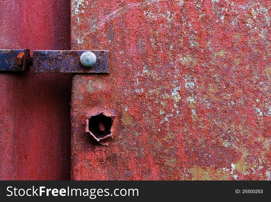 Old painted metal construction in red.