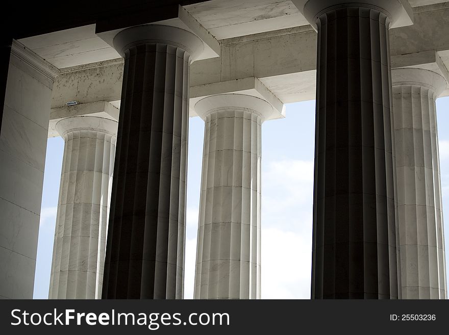 Horizontal photograph of white architectural columns