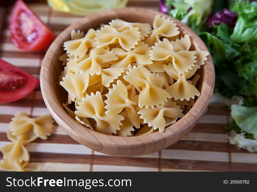 Uncooking pasta in bamboo bowl. Uncooking pasta in bamboo bowl