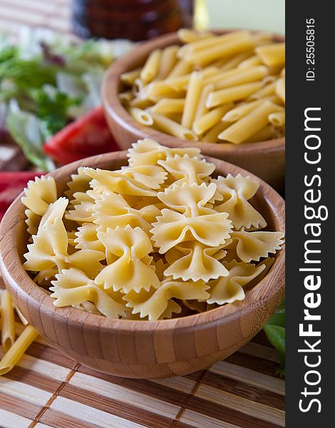 Uncooking pasta in bamboo bowls. Uncooking pasta in bamboo bowls