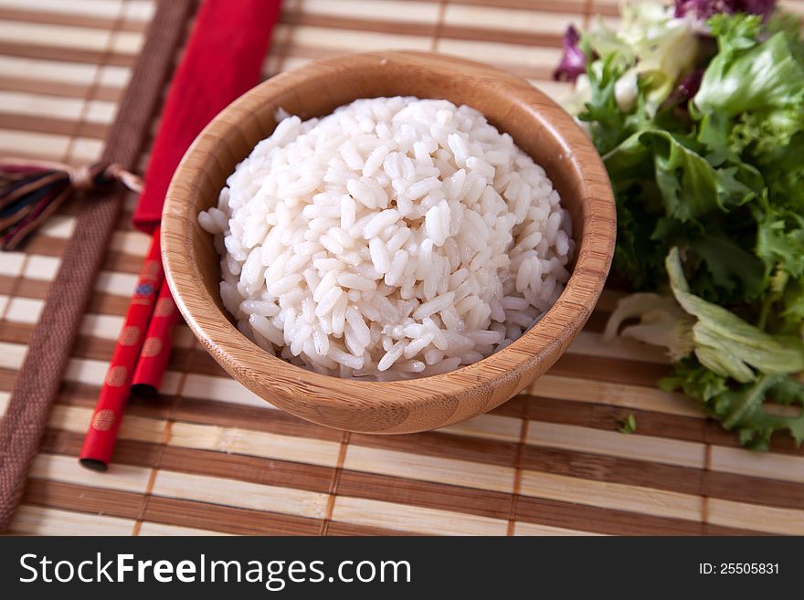 Rice in bowl with chopsticks