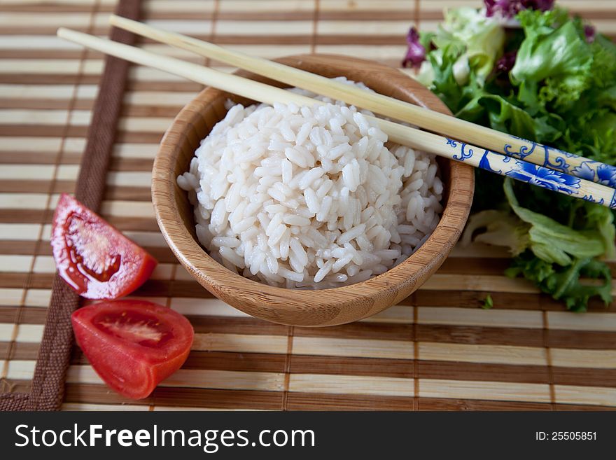 Rice in  bowl with chopsticks