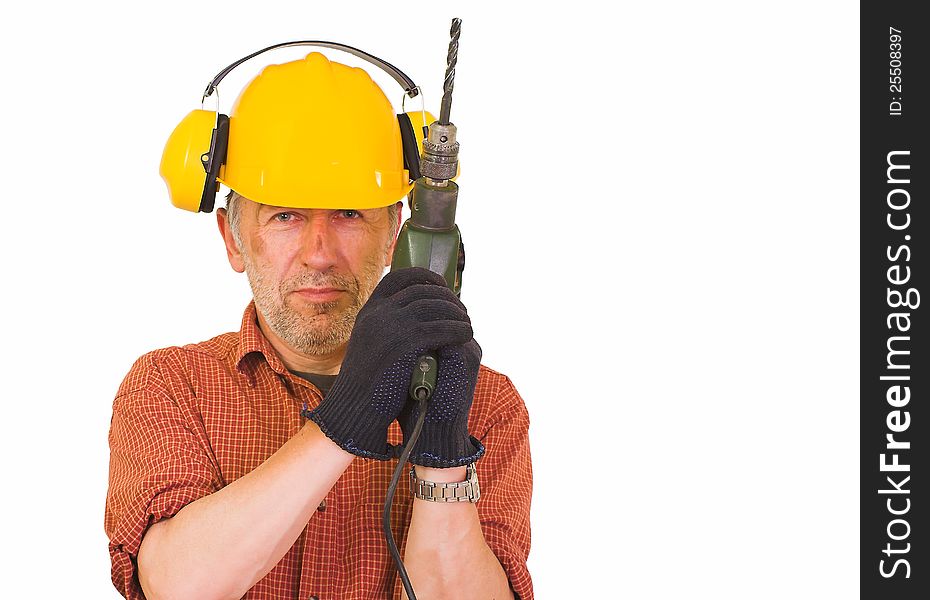 Horizontal image showing a matured, beardy worker with a wrinkled face, wearing a yellow helmet,a shirt and gloves. His face dirty,  he keeps a drill in his hands. Horizontal image showing a matured, beardy worker with a wrinkled face, wearing a yellow helmet,a shirt and gloves. His face dirty,  he keeps a drill in his hands.