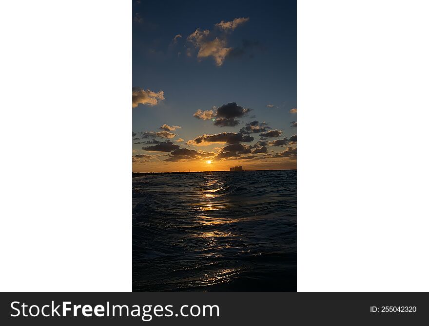 a beautiful landscape view with sun beams through clouds from the see