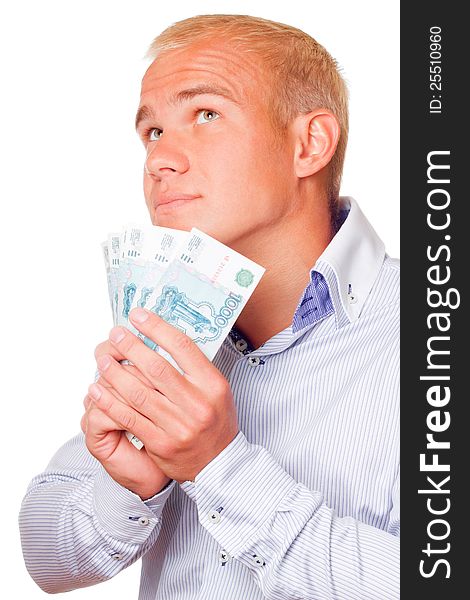 A young businessman with russian money in the hands of a white background. A young businessman with russian money in the hands of a white background.