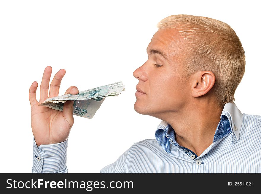 A young businessman with russian money in the hands of a white background. A young businessman with russian money in the hands of a white background.