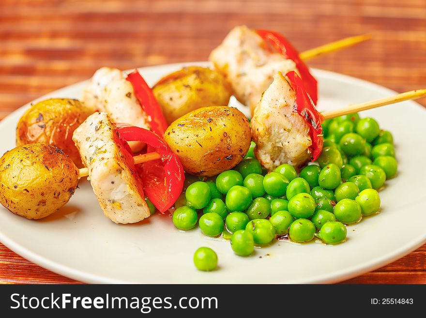 Grilled chicken with potatoes and peas. Grilled chicken with potatoes and peas