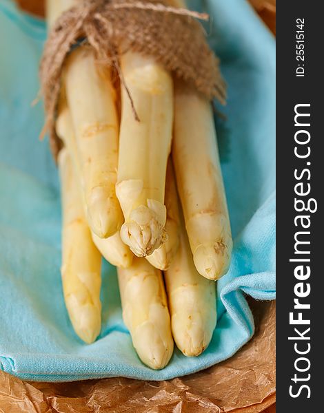 Fresh cut white asparagus on wooden table