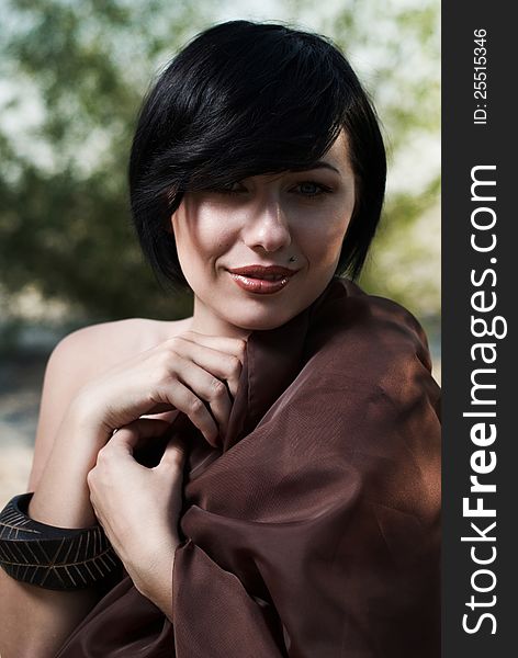 Girl posing in a tree shade