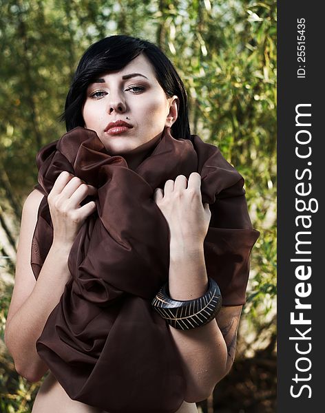 Girl Posing In A Tree Shade