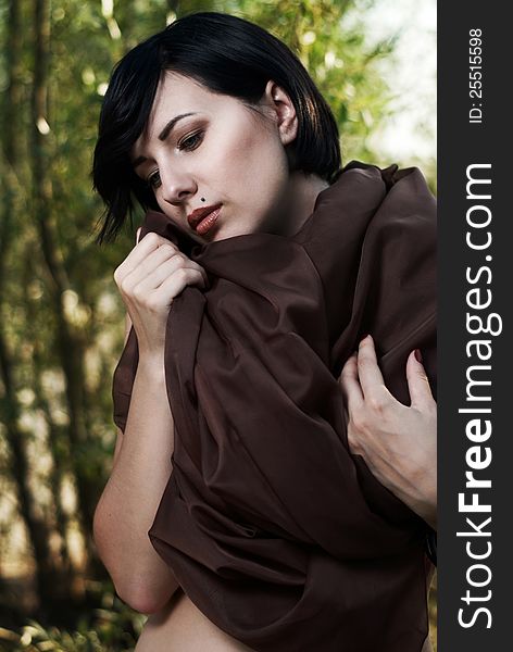 Girl Posing In A Tree Shade