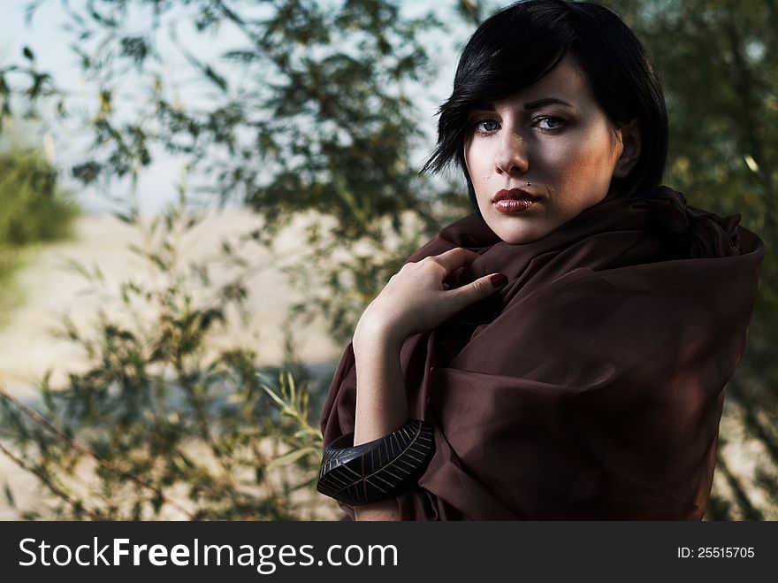 Girl posing in a tree shade