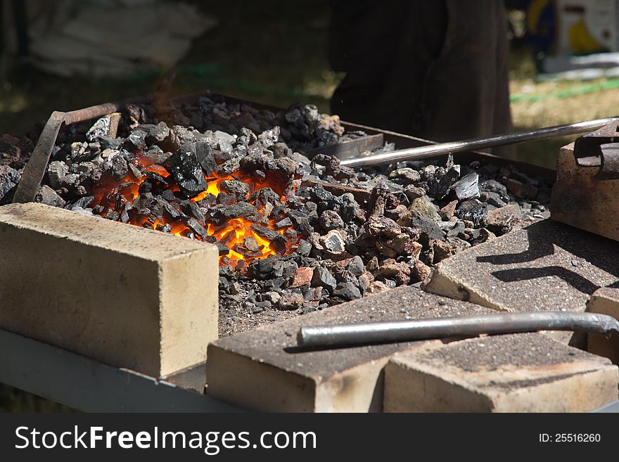 Forge heats the metal part. Forge heats the metal part