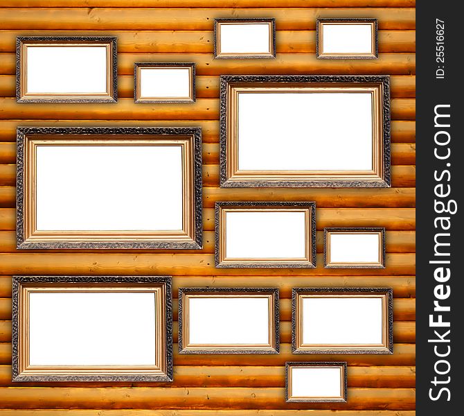 Blank Picture Frames On Wooden Wall