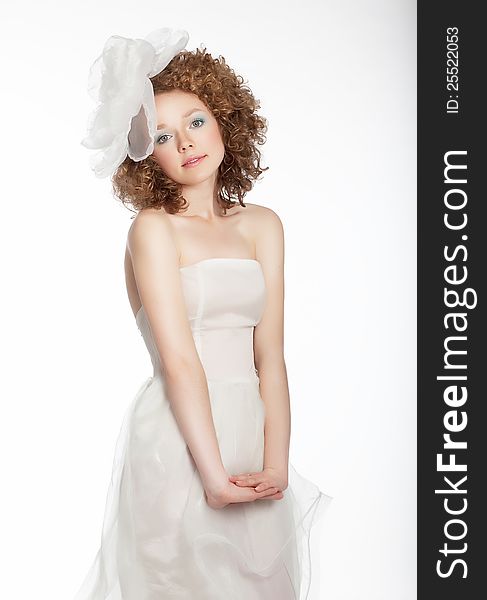 Pretty gentle happy girl in bridal dress.