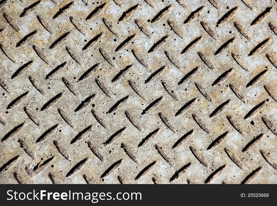 The pretty geometric pattern in this concrete street paving adds interest to the urban street scape. The pretty geometric pattern in this concrete street paving adds interest to the urban street scape.