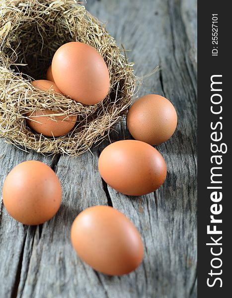 Colorful eggs on old wooden background