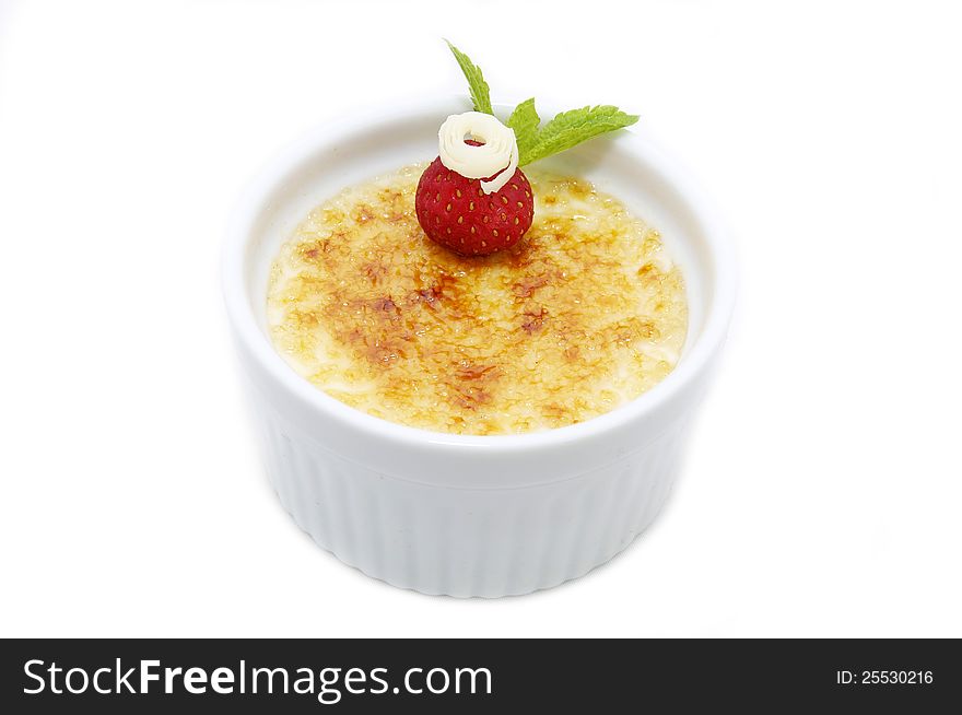 Serving of cream brulee on a table in a restaurant