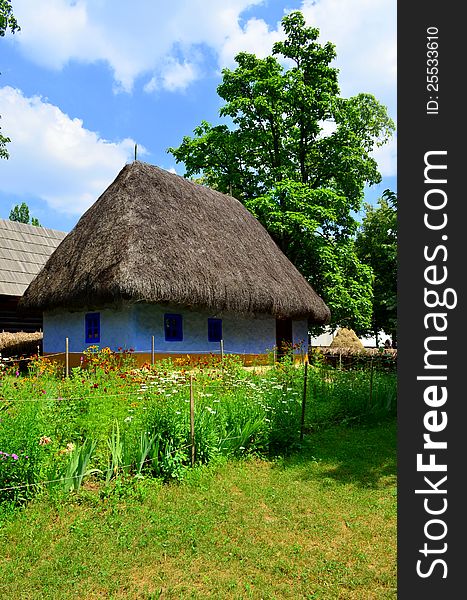 Countryside house with a garden filled with flowers representing peace and purity. Countryside house with a garden filled with flowers representing peace and purity