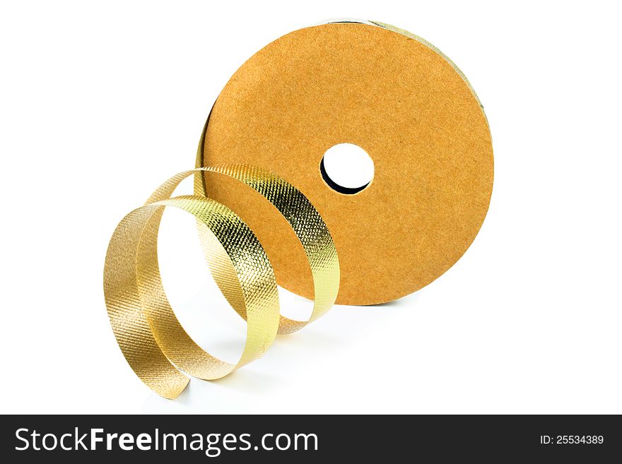 Roll of gold ribbon solated on white background. Roll of gold ribbon solated on white background