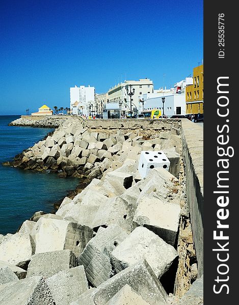 Can you find the Painted Dice hidden in the Blocks by the Harbour wall. Can you find the Painted Dice hidden in the Blocks by the Harbour wall