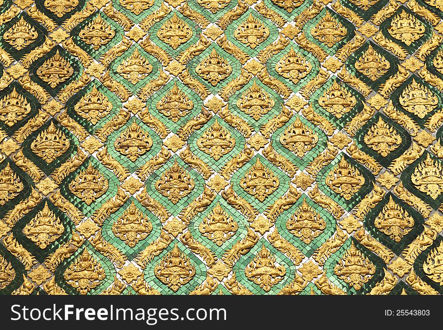 Pattern of Thai art made fom stucco and tile of color glass