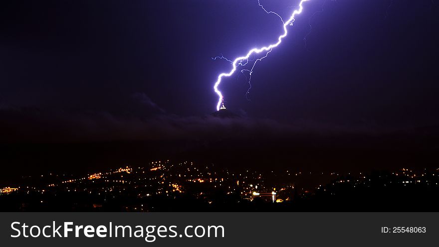 Lightning over the city on the evening.