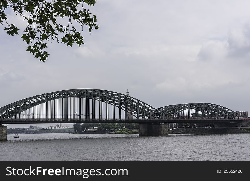 The Hohenzollern Bridge is a railway bridge which spans the River Rhine at the city of Cologne in the federal state of Northrhine-Westphalia in Germany. The bridge was constructed between 1907 and 1911. It was named after the House of Hohenzollern, one of Germany's great ruling families. The Hohenzollern Bridge is a railway bridge which spans the River Rhine at the city of Cologne in the federal state of Northrhine-Westphalia in Germany. The bridge was constructed between 1907 and 1911. It was named after the House of Hohenzollern, one of Germany's great ruling families.