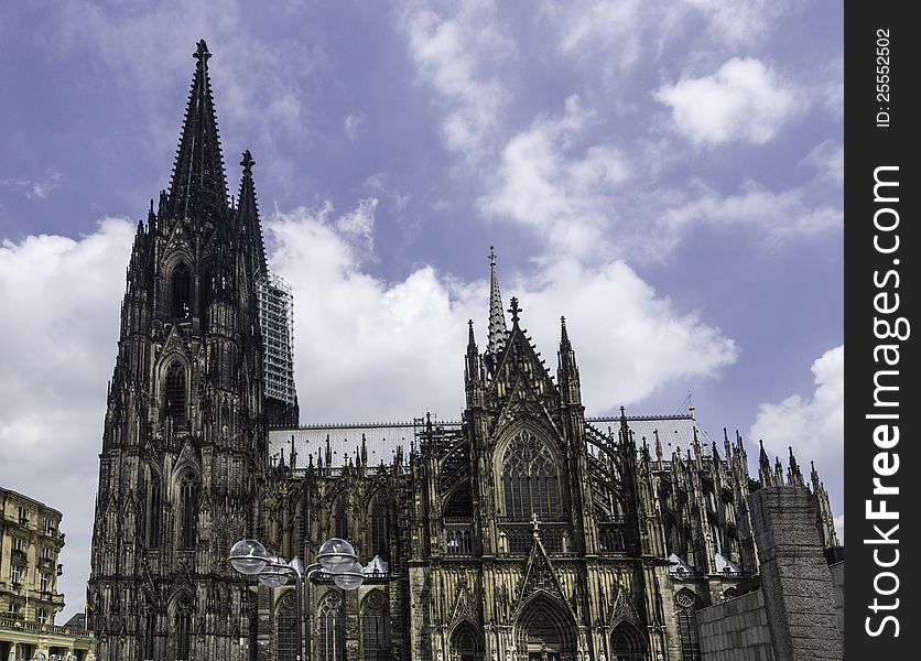 Cologne Cathedral (German: KÃ¶lner Dom, officially Hohe Domkirche St. Peter und Maria, English: High Cathedral of Sts. Peter and Mary) is a Roman Catholic church in Cologne, Germany. It is the seat of the Archbishop of Cologne and the administration of the Archdiocese of Cologne. It is a renowned monument of German Catholicism and Gothic architecture and is a UNESCO World Heritage Site. It is Germany's most visited landmark, attracting an average of 20,000 people a day. Cologne Cathedral (German: KÃ¶lner Dom, officially Hohe Domkirche St. Peter und Maria, English: High Cathedral of Sts. Peter and Mary) is a Roman Catholic church in Cologne, Germany. It is the seat of the Archbishop of Cologne and the administration of the Archdiocese of Cologne. It is a renowned monument of German Catholicism and Gothic architecture and is a UNESCO World Heritage Site. It is Germany's most visited landmark, attracting an average of 20,000 people a day.