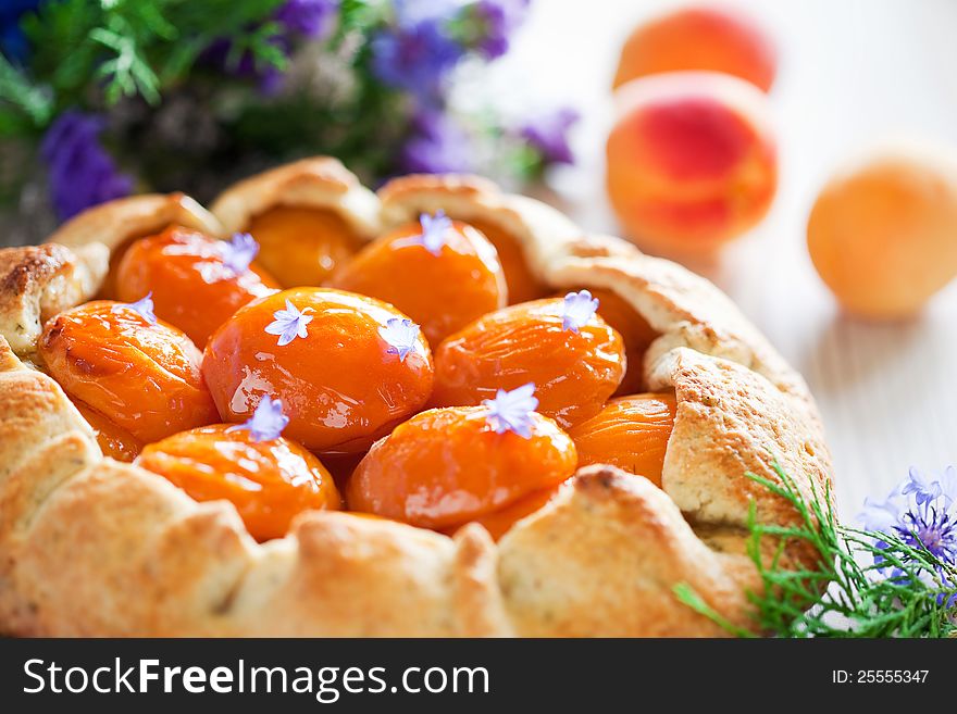 Tart with apricots and lavender, selective focus