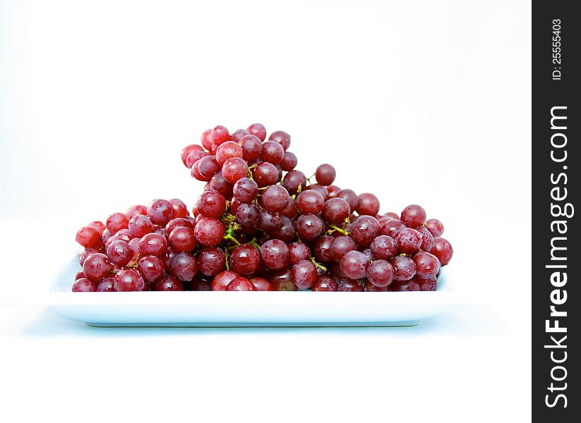 Fresh red delicious grapes on plate. Fresh red delicious grapes on plate