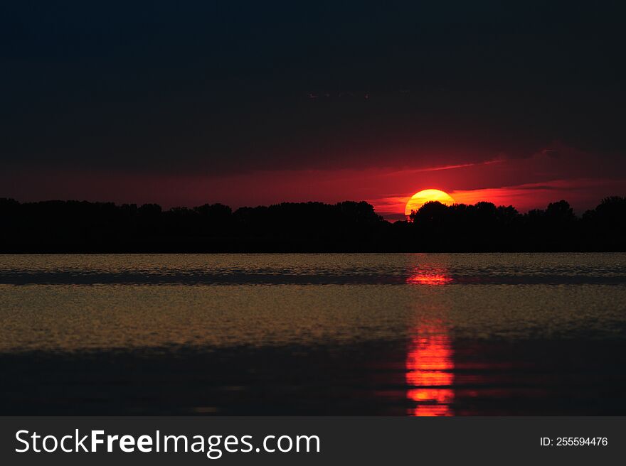 A dramatic sunset at Lake Tisza, Hungary, in the summer