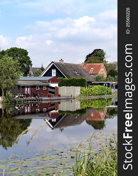 Traditional houses and canal in Holland. Traditional houses and canal in Holland